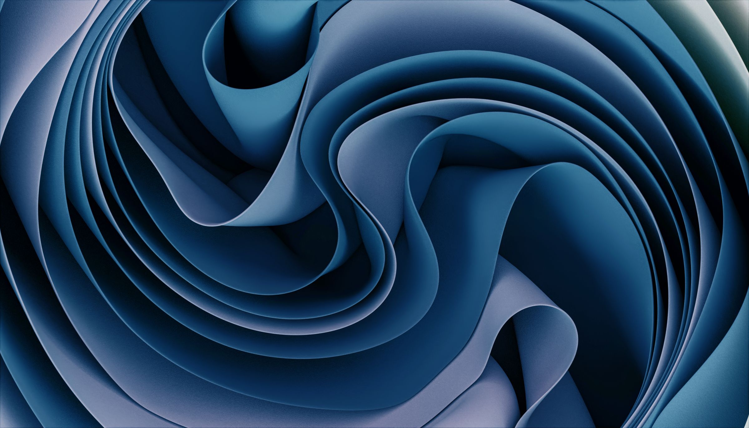 Layers of blue paper curling into a spiral